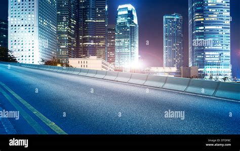 Highway and city at night Stock Photo - Alamy