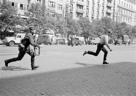 The Prague Spring: Soviet soldier chasing young man who had thrown ...