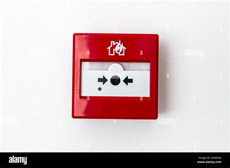 Red fire alarm panel box is on the wall, to smash glass and press ...