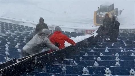 Buffalo Bills fans make snow slide while shoveling stadium