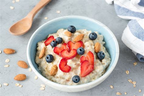 Oatmeal porridge bowl with berries containing porridge, oatmeal, and ...