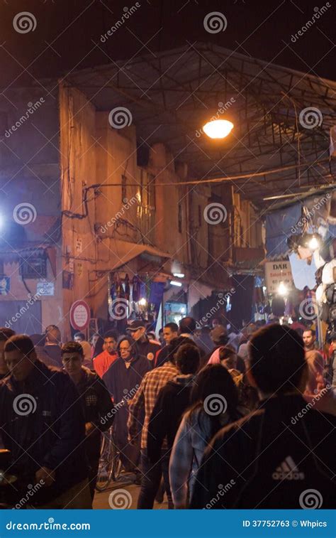 Crowded streets at night editorial stock photo. Image of marrakesh ...