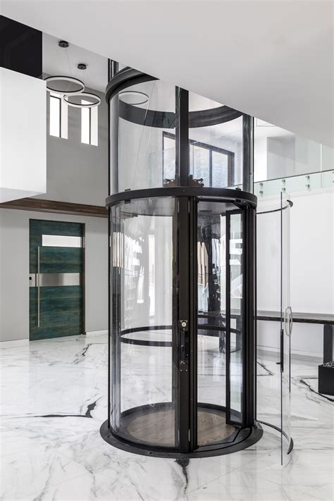 Black Vuelift round with cab gate open // Glass elevator // House ...