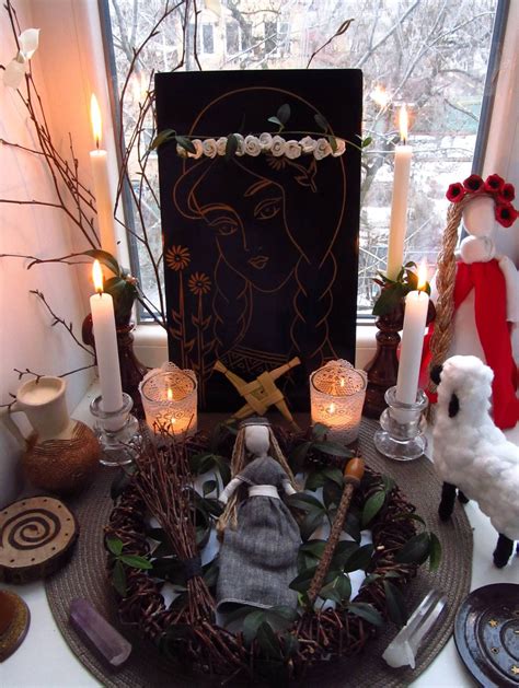 a table topped with candles and christmas decorations