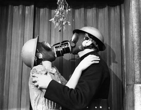 Gas Mask Kiss by Fox Photos