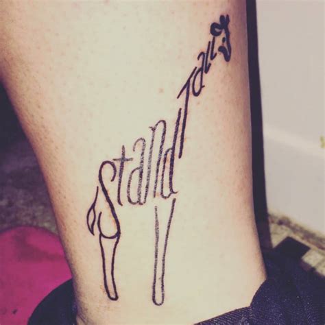 "Stand tall" giraffe tattoo on Jessica's left shin.