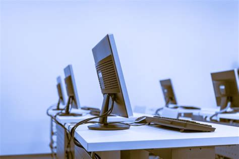 Premium Photo | Computers on desks in lab