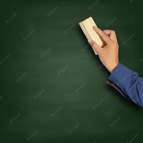 Premium Photo | Cleaning a blackboard