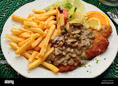 Schnitzel with mushroom sauce Stock Photo - Alamy