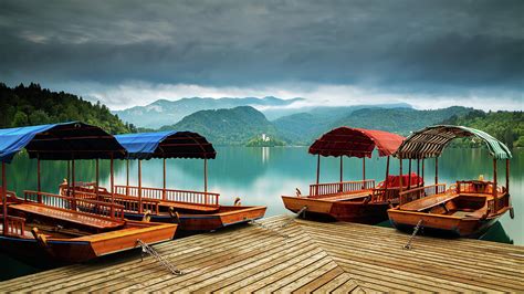 Pletna Boats at Lake Bled Photograph by Ian Middleton - Pixels