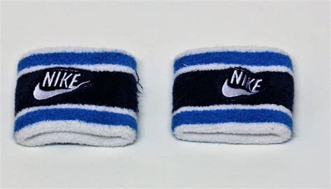 NIKE WRIST SWEATBANDS WHITE & BLUE WITH NIKE LOGO AND TICK SWEAT BANDS ...