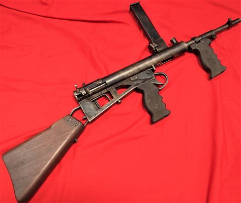 Replica WW2 Australian Owen Sub Machine Gun. Wooden butt stock attached ...