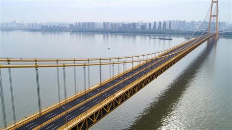 World's longest double-deck suspension bridge opens to traffic - CGTN