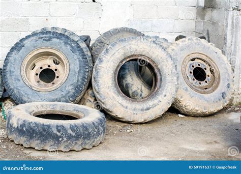 Tractor Tires Used Sort of Wall, Smeared with Mud Stock Image - Image ...