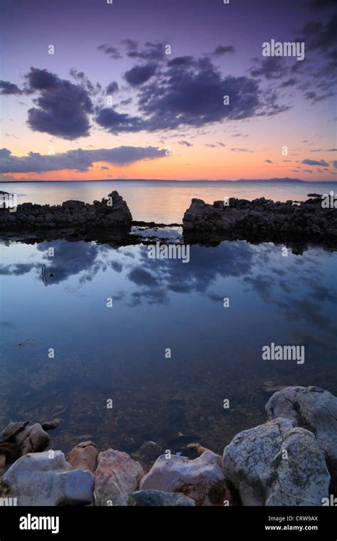 Sunrise at sea with clouds Stock Photo - Alamy