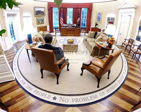 BARACK OBAMA READS BRIEFING MATERIAL IN THE OVAL OFFICE - 8X10 PHOTO ...