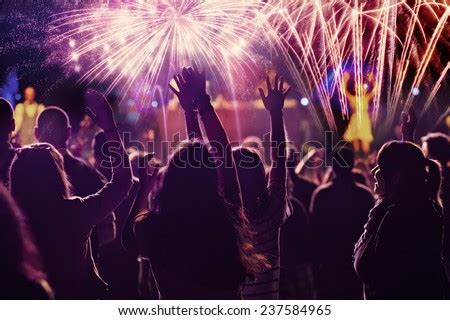 New Year concept - cheering crowd and fireworks - Stock Image - Everypixel