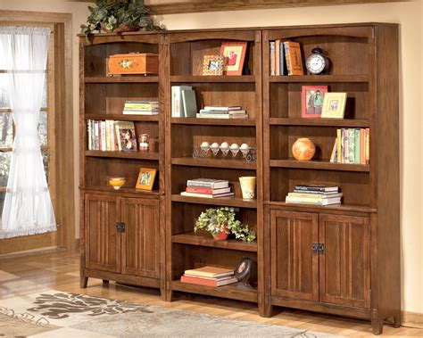 Cross Island Large Door Bookcase from Ashley (H319-18) | Coleman Furniture