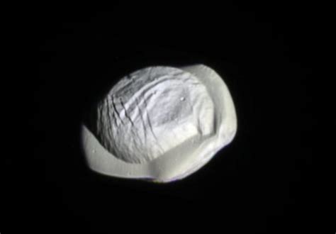 It's a UFO! It's a walnut! It's Pan, one of Saturn's weirdest moons