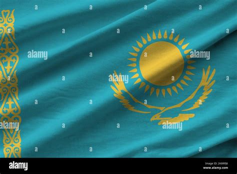 Kazakhstan flag with big folds waving close up under the studio light ...