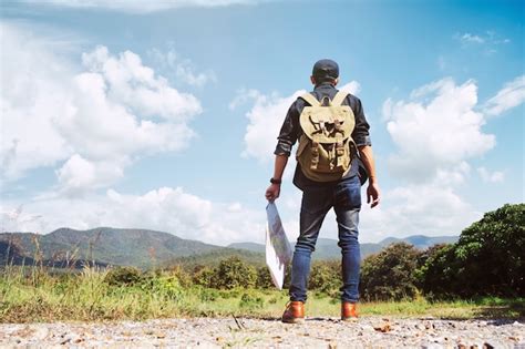 Free Photo | Young Man Traveler with backpack relaxing outdoor.