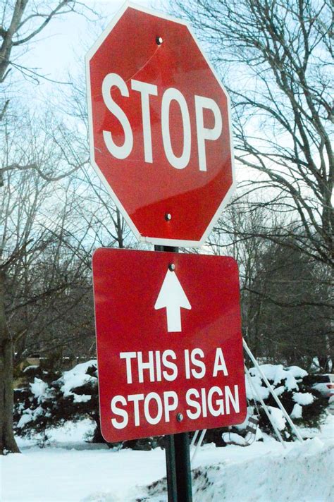 This stop sign has a sign under it to remind you that the above stop ...