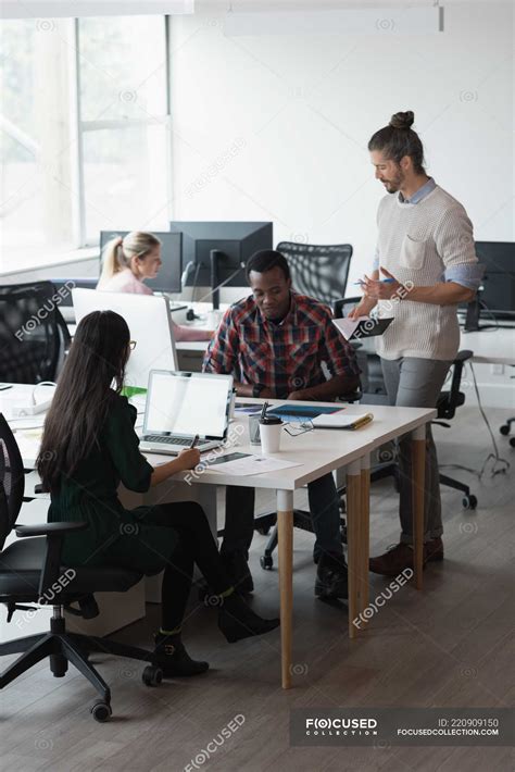 Group of business people working in the office — male, Smart Casual ...