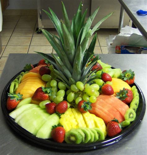 Fruit Tray. Cut off the top of a pineapple for a center piece ...