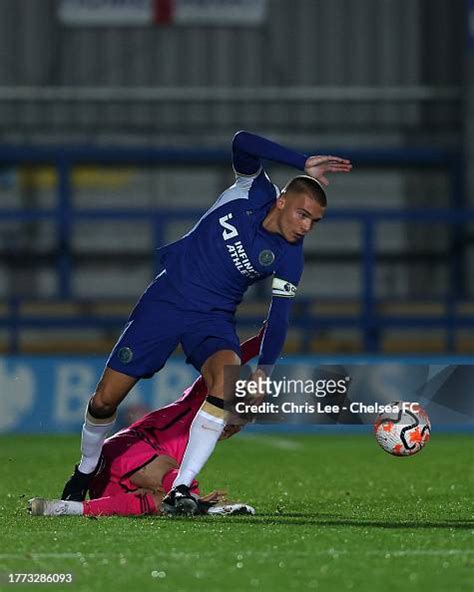 Alfie Gilchrist of Chelsea gets away from a challenge by Kristian ...