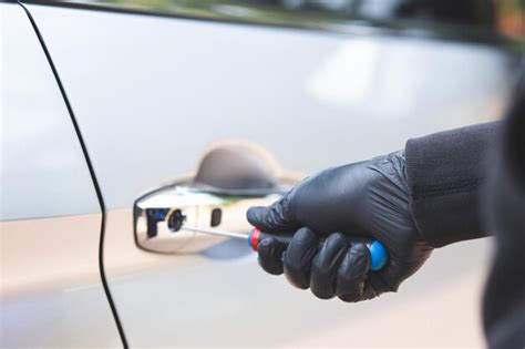 Premium Photo | Robbers are stealing cars in the parking lot