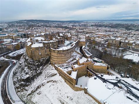 An aerial view of a snow covered Edinburgh Castle, Scotland, UK ...