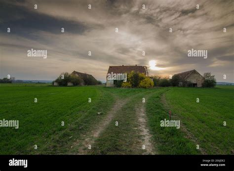 abandoned old farm with sunset Stock Photo - Alamy