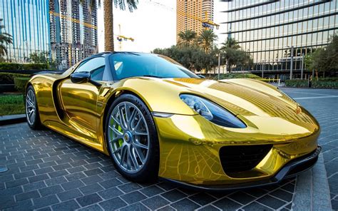 Gold Porsche 918 Spyder in the parking Wallpaper Download 2880x1800