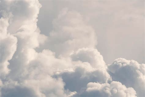 Premium Photo | White fluffy clouds background