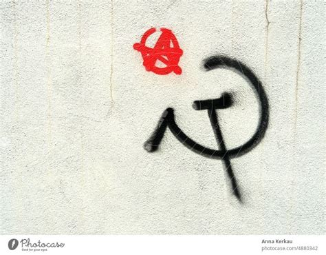 Hammer and sickle graffiti on white wall - a Royalty Free Stock Photo ...