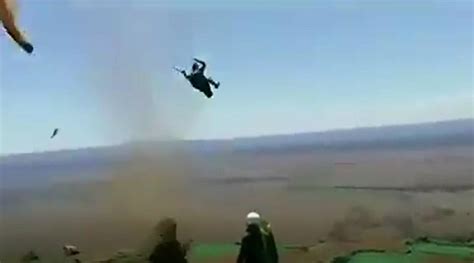 Video of paraglider thrown off a cliff in Manilla by dust devil, lands ...