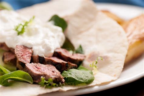 Grilled lamb souvlaki wrap stock photo. Image of bread - 214187952