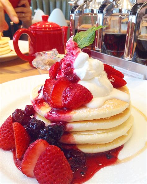 Strawberry pancakes with maple syrup