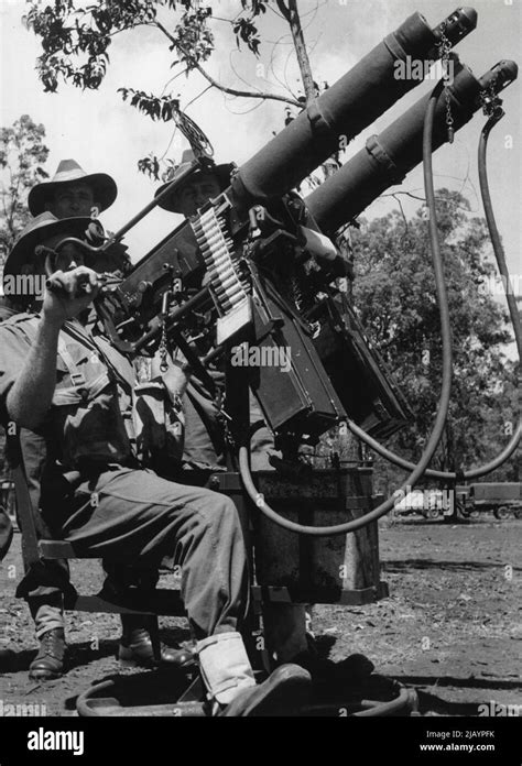 Members of a machine-gun unit man twin vickers on a radial ack-ack ...