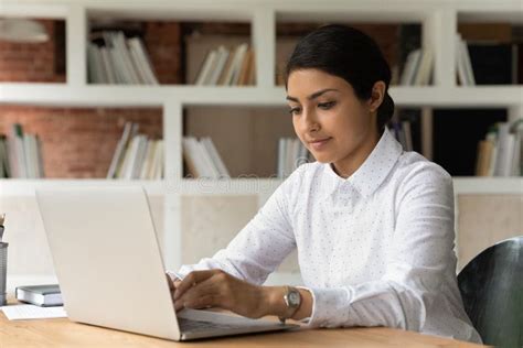 Young Indian Female Employee Work on Laptop Stock Photo - Image of ...