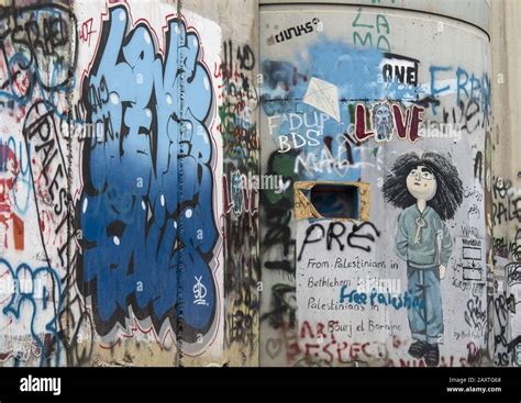 Jerusalem, Israel - 12/15/2019: graffiti on the wall between border of ...