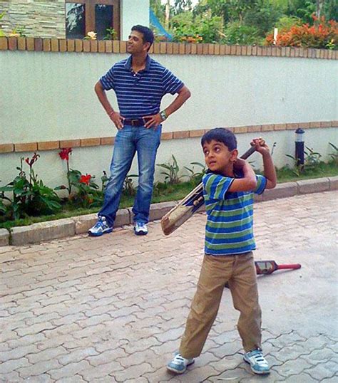 Rahul Dravid plays with son Samit outside their home in Bangalore ...