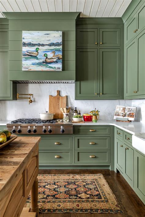 Traditional Farmhouse Kitchen With Green Cabinets and Artwork ...