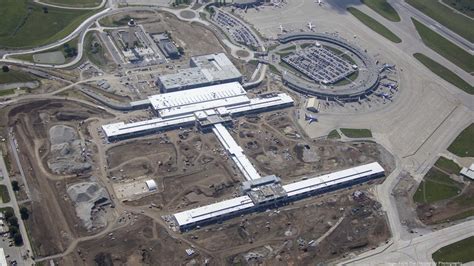 KCI Quarterly: Work progresses, from glass walls to head house stone to ...