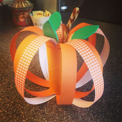 Pumpkin made with scrapbook paper and a painted toilet paper tube. Easy ...