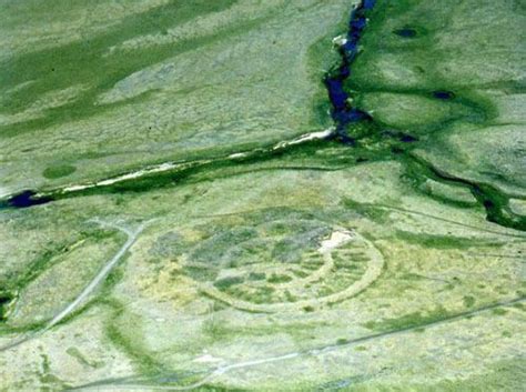 an aerial view of a circular shaped area in the middle of nowhere