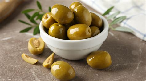 Why You Should Try Adding Olive Pits To Your Bottle Of Oil