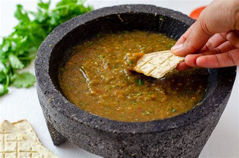 Molcajete salsa made with charred tomatoes, peppers, onion, garlic, and ...