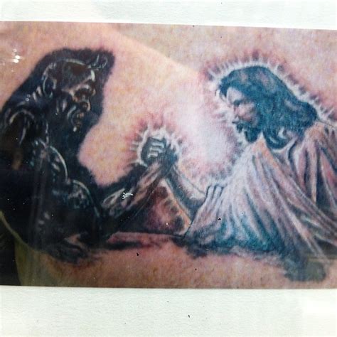 Tattoo of The Devil and Jesus arm wrestling? | Darren Garrett | Flickr