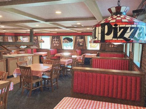 a restaurant with red and white checkered tablecloths